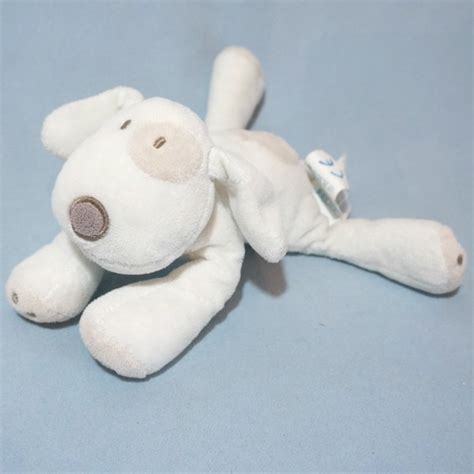 Toodoux spécialiste en sos doudou Obaibi Okaidi chien blanc et beige