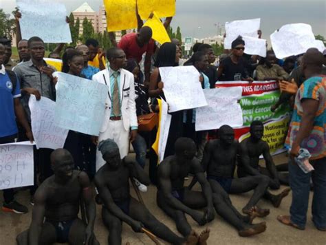 Photos Partially Naked Abuja Indigenes Stage Protest Over Perceived