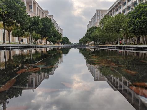 White Concrete Building Near Body Of Water During Daytime Photo Free Grey Image On Unsplash