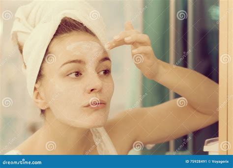 Woman Applying Mask Cream On Face In Bathroom Stock Image Image Of