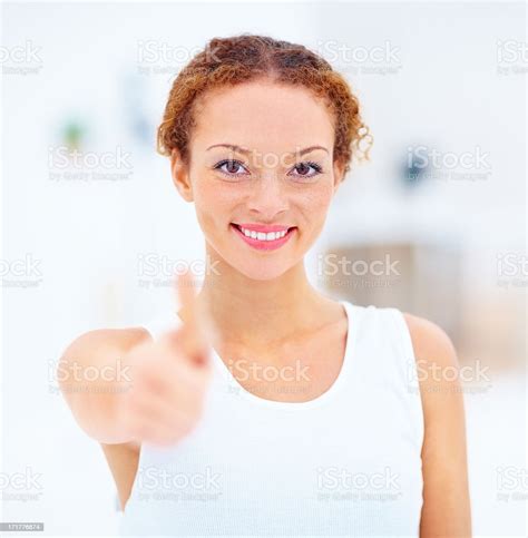 Woman In A Positive Attitude Showing Thumbs Up Stock Photo Download