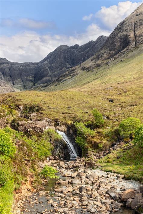 Slender Waterfall Feeding Fairy Pools With Isle Of Skye S Cuillin