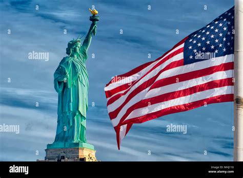 Usa American Flag Stars And Stripes On Statue Of Liberty Blue Sky