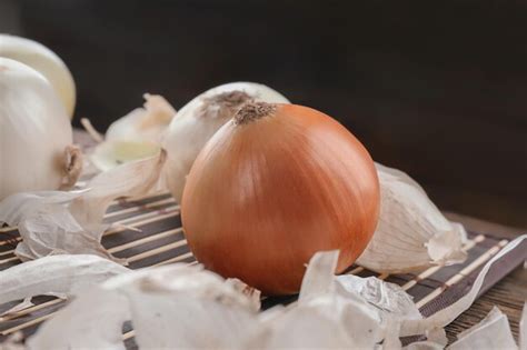 Premium Photo Fresh Ripe Onions On Table