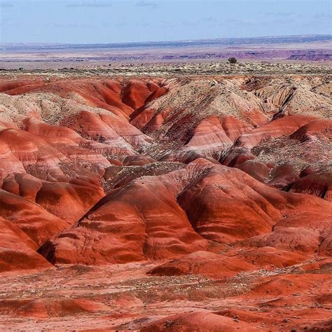 The Painted Desert Is A Huge Expanse Of Badland Hills And Buttes In