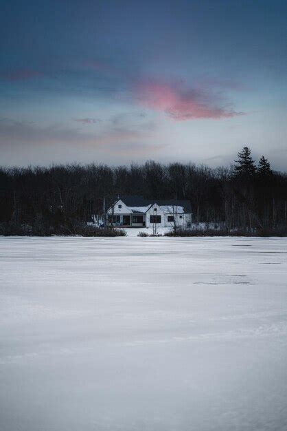 Premium Photo | Small snowy houses in a town with amazing sky and mountains