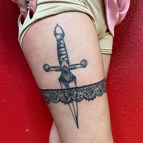 Dagger Tattoo | Dagger tattoo, Knife tattoo, Thigh garter tattoo