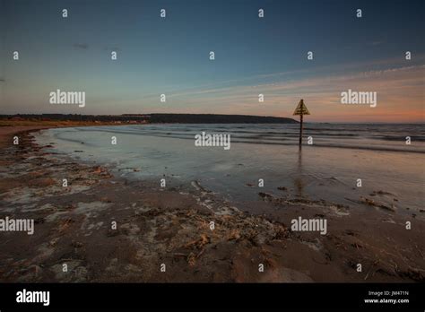 Sunset beach scene Stock Photo - Alamy