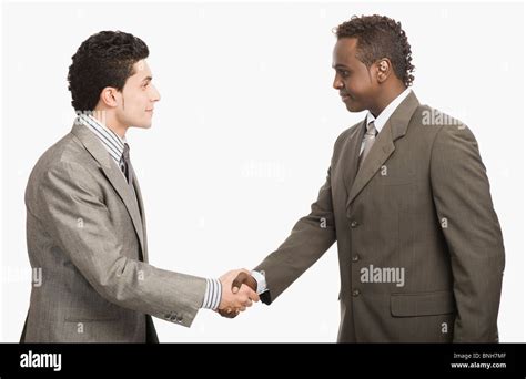 Two Businessmen Shaking Hands Stock Photo Alamy