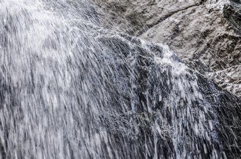 Premium Photo | Splashing waterfall in a ravine