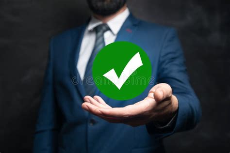 Man Holding A Check Mark Icon In His Hand Stock Photo Image Of