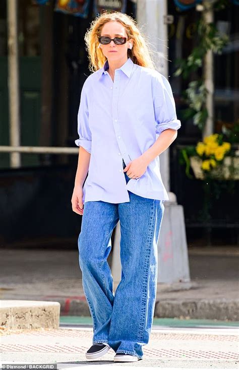 Jennifer Lawrence Keeps Her Look Casual In Baggy Jeans And An Oversized