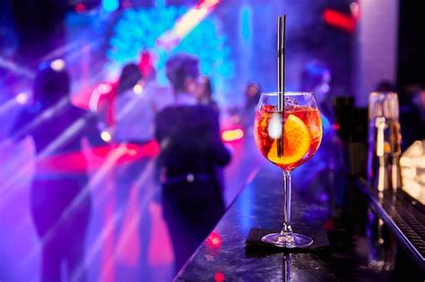 Premium Photo | Alcoholic cocktail in a nightclub against the backdrop ...