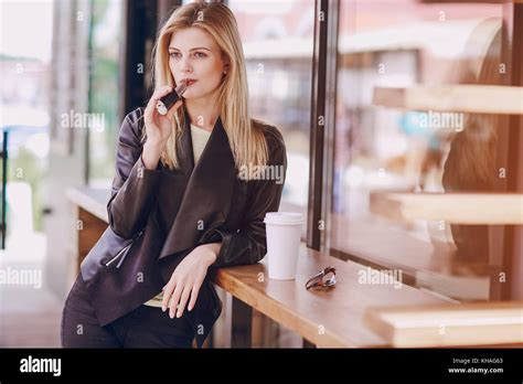 Beautiful Blonde In A Cafe Stock Photo Alamy