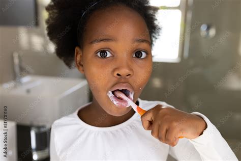 Image Of African American Girl Brushing Teeth Stock Photo Adobe Stock