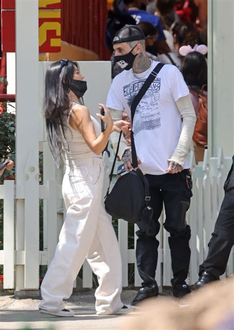 KOURTNEY KARDASHIAN and Travis Barker at Disneyland in Anaheim 05/19 ...