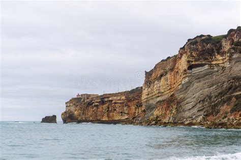 The Cliff in Nazare, Where the Most Famous Lighthouse in the World is Located Stock Photo ...