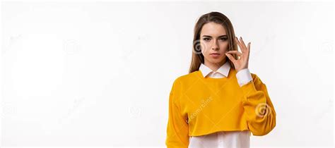 Brunette Girl Is Showing Zip Gesture As If Shutting Mouth On Key