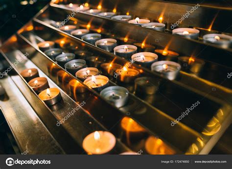 Burning candles on church altar — Stock Photo © Amvorsuf #172474850