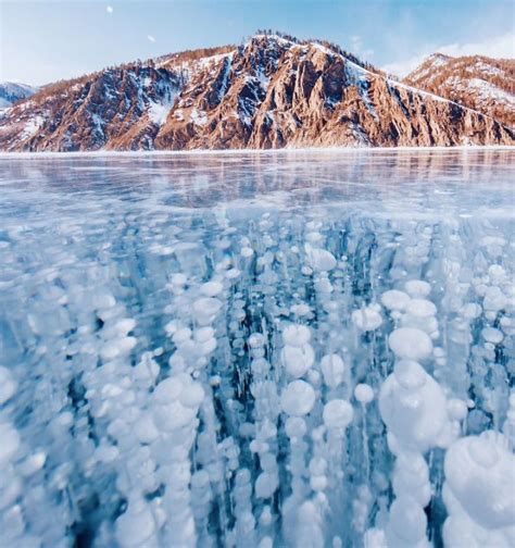 Russian Photographer Captures Stunning Images Of Frozen Lake Baikal