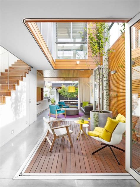 the inside of a house with wooden floors and stairs leading up to an ...