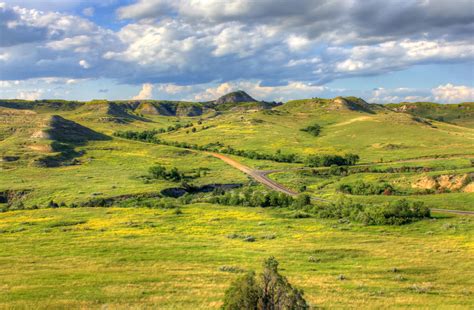 Landscapes of grasslands and hills at Theodore Roosevelt National Park ...