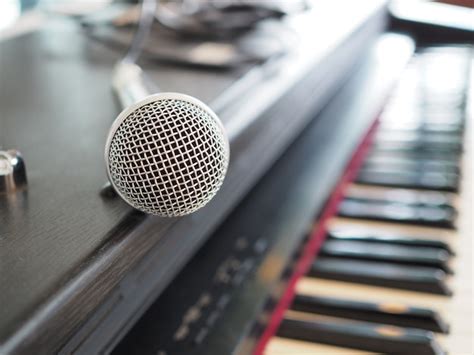 Premium Photo | Microphone and piano keyboard