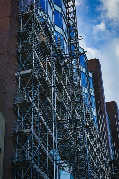 Complex Scaffolding Structure On The Side Of A Modern Building With