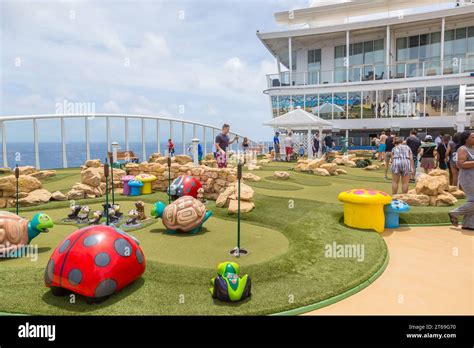 Cruise Passengers Playing Miniature Golf On The Royal Caribbean Allure