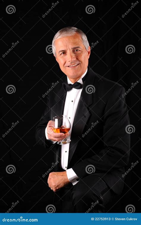 Middle Aged Man In A Tuxedo With Brandy Snifter Stock Image Image Of