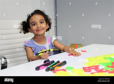 3 Year Old Latina Brunette Girl With Curly Hair Draws As Therapy For Autism And Attention