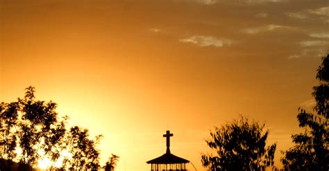 Silhouette of a Cross During Sunset · Free Stock Photo