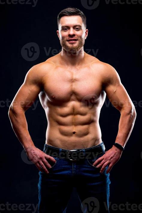 Muscular Guy With Naked Torso Posing With Hands On Waist Studio Photo