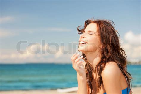 laughing woman on the beach | Stock image | Colourbox