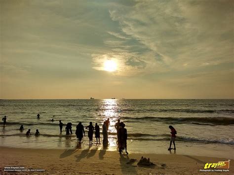 People and the sunset on an evening in Panambur Beach, Mangalore ...