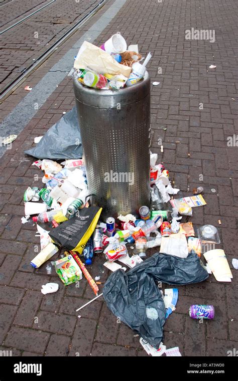modern overflowing rubbish bin   city stock photo alamy
