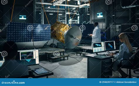 Team Of Engineers Working On Satellite Construction Aerospace Agency