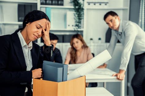 Sad Employee Packing Her Belongings After Being Fired For Not Being