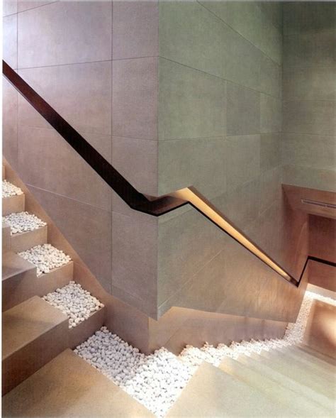 The Stairs Are Made Of Wood And Have White Carpet