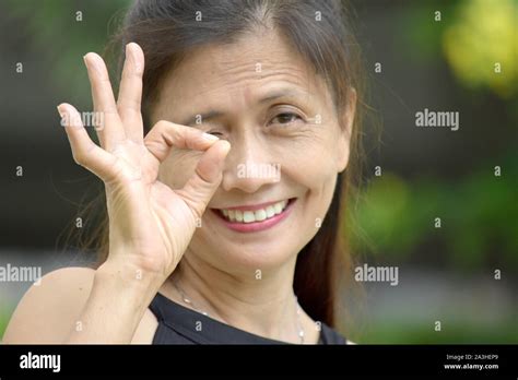 Senior Minority Adult Female And Okay Sign Stock Photo Alamy