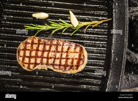 Steak In Grill Pan Stock Photo - Alamy