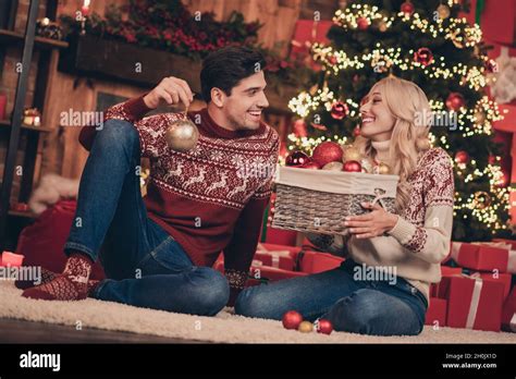 Photo Of Attractive Funny Young Wife Husband Wear Print Sweaters Smiling Decorating Noel Tree