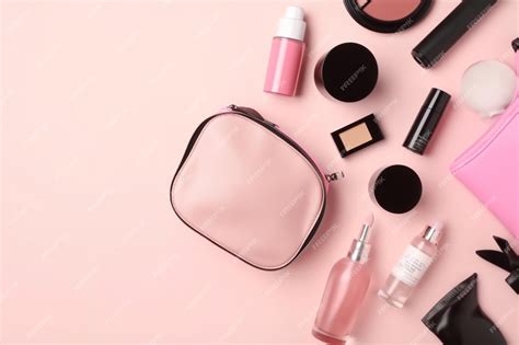 Premium Photo Cosmetic Products Flowing From Makeup Bag On Pastel Pink Background Flat Lay Top