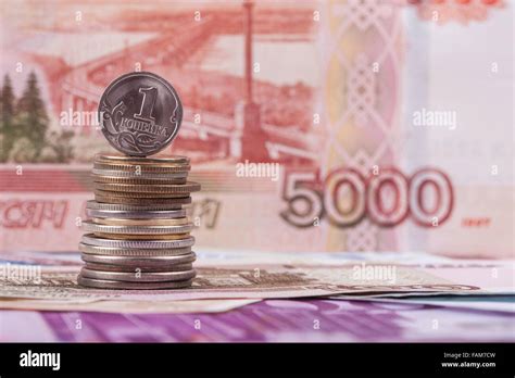 Russian coin kopeck on the background of ruble banknote Stock Photo - Alamy