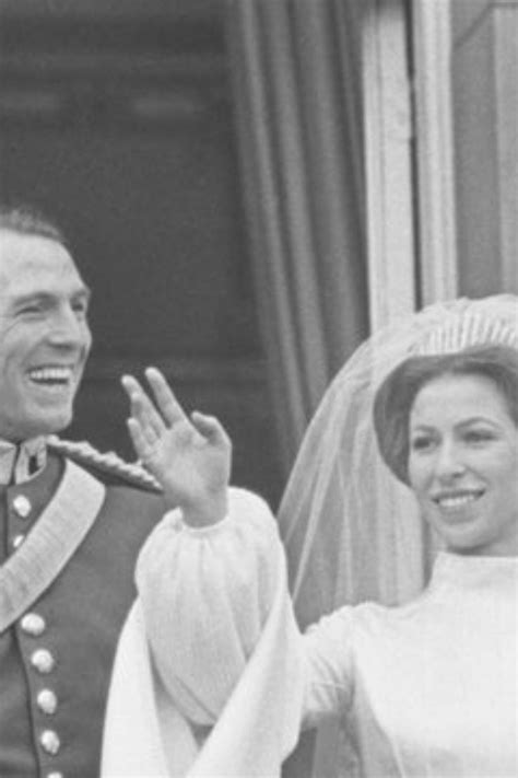 The Bride And Groom Wave From Their Balcony