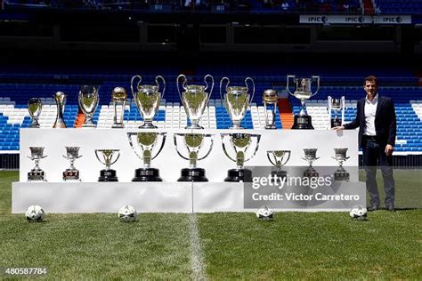 Iker Casillas poses with trophies he has won during his career in ...