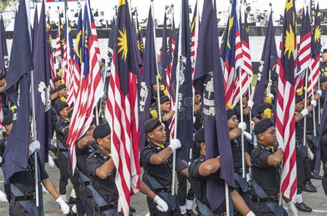 Malaysian Police Personnel Marching With Flags During Th Malaysia