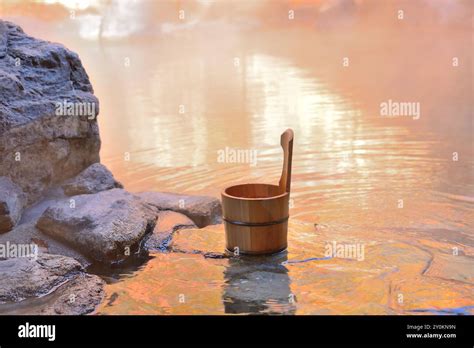 Open Air Hot Spring And A Pail With Autumn Foliage Stock Photo Alamy