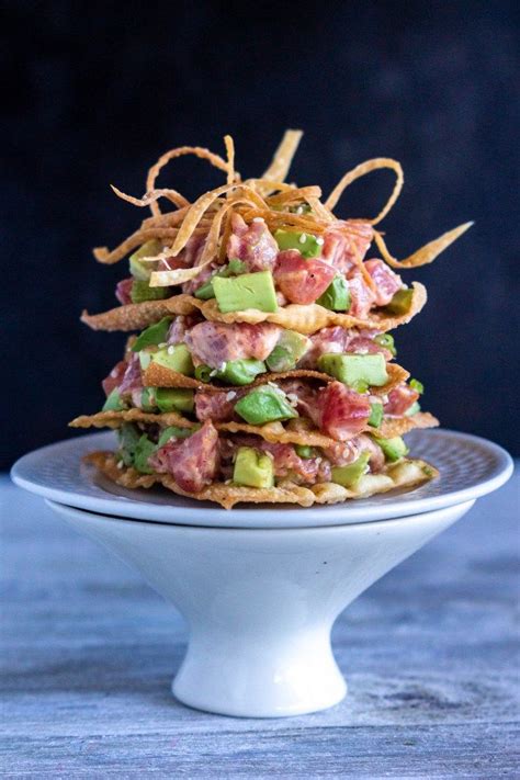 A spicy tuna avocado tower is a gorgeous, fun, and super easy appetizer using crispy fried ...