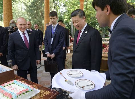 A cake, a vase and... a BOX of ice cream: Putin’s birthday gifts that ...